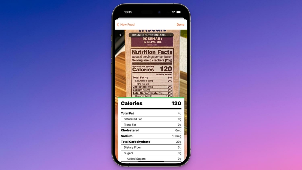 A smartphone screen displaying a scanned nutrition label for 'Rosemary & Olive Oil Artisan Crackers'. The label shows a serving size of 6 crackers at 120 calories, with details on total fat, cholesterol, sodium, carbohydrates, dietary fiber, and sugars. This digital interface simplifies nutritional tracking by converting label information into an easily readable format against a purple to blue gradient background.