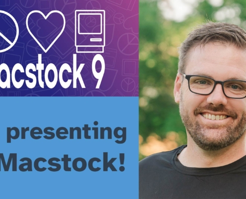 Mike, a man with glasses and a beard wearing a black shirt, smiles at the camera against a blurred green outdoor background. To his left is the Macstock 9 logo featuring peace, heart, and computer icons, with text announcing "I'm presenting at Macstock!" on a blue background.
